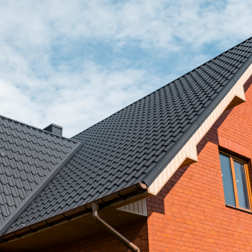Metal vs. Shingle Roofs: Which Handles Storms Better?
